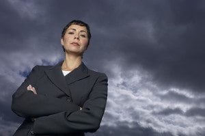 Self confident woman against a stormy cloud
